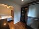 Bedroom with ceiling fan viewed from closet featuring built in shelves and rods at 9075 W 66Th Ave, Arvada, CO 80004