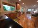 Modern kitchen with granite countertops, stainless steel appliances, and hardwood floors at 9075 W 66Th Ave, Arvada, CO 80004