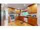 Well-equipped kitchen with stainless steel appliances, wood cabinets, and stylish countertops at 9075 W 66Th Ave, Arvada, CO 80004