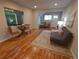 Cozy living room with hardwood floors, natural light, and stylish furniture at 9075 W 66Th Ave, Arvada, CO 80004