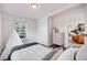 Bright bedroom featuring a comfortable bed, modern decor, and abundant natural light at 3249 W Alaska Pl, Denver, CO 80219