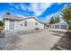 Charming single-Gathering home with well-maintained front yard and detached two-car garage at 3249 W Alaska Pl, Denver, CO 80219