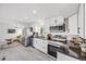 Modern kitchen featuring stainless steel appliances, granite countertops, and ample cabinet space at 3249 W Alaska Pl, Denver, CO 80219