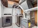 Laundry area features washer, dryer, and Goodman furnace at 3249 W Alaska Pl, Denver, CO 80219