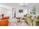 Cozy living room featuring stylish furnishings, decorative rug, and bright natural light at 3249 W Alaska Pl, Denver, CO 80219