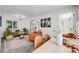Modern living room with stylish furniture, decorative rug, and abundant natural light at 3249 W Alaska Pl, Denver, CO 80219