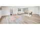 Versatile living space with laminate flooring and ample natural light, perfect for various activities or relaxation at 3249 W Alaska Pl, Denver, CO 80219