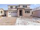 Beautiful two-story home featuring stone accents, a two-car garage, and neutral color palette at 9122 Telluride Ct, Commerce City, CO 80022