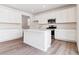 Kitchen with a center island, stainless steel appliances, and quartz countertops at 9122 Telluride Ct, Commerce City, CO 80022