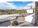 Inviting back patio with a hot tub and scenic mountain views at 174 Sage Dr, Breckenridge, CO 80424