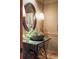 Stylish powder room features a unique stone bowl sink and an elegant oval mirror at 174 Sage Dr, Breckenridge, CO 80424