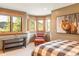 Comfortable bedroom with bay window and a relaxing sitting area and scenic outdoor views at 174 Sage Dr, Breckenridge, CO 80424