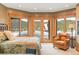 Inviting bedroom features natural light, cozy seating, and stunning outdoor views at 174 Sage Dr, Breckenridge, CO 80424