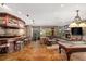 Game room with wet bar, gas fireplace, and pool table at 174 Sage Dr, Breckenridge, CO 80424