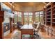 Elegant home office with custom built-ins, fireplace, and stunning views at 174 Sage Dr, Breckenridge, CO 80424
