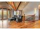 Cozy seating area with hardwood floors, a railing, and a sliding glass door to a patio at 174 Sage Dr, Breckenridge, CO 80424