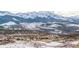 Stunning panoramic view of snow-capped mountains and a luxury community at 174 Sage Dr, Breckenridge, CO 80424