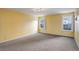 Bedroom with soft carpeting and natural light from dual windows at 2466 S Vaughn Way # A, Aurora, CO 80014