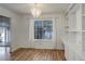 Bright dining room with a chandelier, large windows, and built in cabinets at 2466 S Vaughn Way # A, Aurora, CO 80014