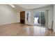 Cozy living room with stone fireplace and sliding doors to the outside at 2466 S Vaughn Way # A, Aurora, CO 80014