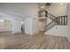 Open concept living space with stairs leading to the second floor at 2466 S Vaughn Way # A, Aurora, CO 80014