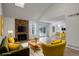 Staged living room with stone fireplace, vaulted ceilings, and sliding glass doors at 2466 S Vaughn Way # A, Aurora, CO 80014