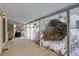 Wide shot of covered back patio with grill and snowy backyard at 2466 S Vaughn Way # A, Aurora, CO 80014