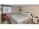 Bright bedroom with a queen bed and sitting chair at 725 Osceola St, Denver, CO 80204