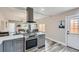 Modern kitchen with gray cabinets, stainless steel appliances and island at 725 Osceola St, Denver, CO 80204