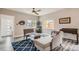 Cozy living room with stylish furniture, a ceiling fan, and natural light from the windows at 725 Osceola St, Denver, CO 80204