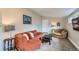 Relaxing living room featuring a sectional sofa and accent chair at 725 Osceola St, Denver, CO 80204