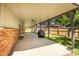 Open back patio with brick pillars and access to backyard at 12475 W 38Th Ave, Wheat Ridge, CO 80033