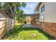 A covered back patio offers room to relax in this home's grassy fenced backyard at 12475 W 38Th Ave, Wheat Ridge, CO 80033