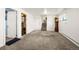 Finished basement with new carpet, easy access to stairs, and a vintage grandfather clock at 12475 W 38Th Ave, Wheat Ridge, CO 80033