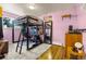 Unique bedroom with a loft bed, maximizing space, and featuring hardwood accents at 12475 W 38Th Ave, Wheat Ridge, CO 80033