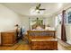 Comfortable bedroom featuring a ceiling fan and hardwood floors, with an abundance of light at 12475 W 38Th Ave, Wheat Ridge, CO 80033
