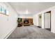 Spacious living room with a brick fireplace and a large window for natural light at 12475 W 38Th Ave, Wheat Ridge, CO 80033