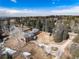 Aerial view of a home with mature trees and a circular driveway at 3720 E Quincy Ave, Cherry Hills Village, CO 80113