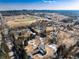 Aerial view of home near a sports complex and many trees at 3720 E Quincy Ave, Cherry Hills Village, CO 80113