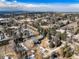 Aerial view of a home situated within a tree-filled residential neighborhood at 3720 E Quincy Ave, Cherry Hills Village, CO 80113