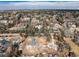 Aerial view of home nestled within a wooded neighborhood at 3720 E Quincy Ave, Cherry Hills Village, CO 80113