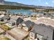 Beautiful aerial view of the neighborhood featuring a lake and mountain views at 17855 Lake Side Dr, Monument, CO 80132