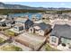 An aerial view of a neighborhood with fenced yards, sidewalks, and a mountain backdrop at 17855 Lake Side Dr, Monument, CO 80132