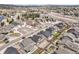 A high-angle view of a modern planned community showing streets and mountain backdrop at 17855 Lake Side Dr, Monument, CO 80132