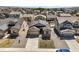 An aerial view showcasing the community layout with manicured lawns, sidewalks, and tree-lined streets at 17855 Lake Side Dr, Monument, CO 80132