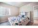 Bedroom with a window with bars, a queen size bed, and gray carpet at 17855 Lake Side Dr, Monument, CO 80132