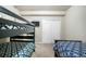 Cozy bedroom featuring bunk beds with unique patterned bedding and double door closet for storage at 17855 Lake Side Dr, Monument, CO 80132