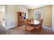 Dining room with a large wooden table and eight chairs next to a wooden hutch at 17855 Lake Side Dr, Monument, CO 80132