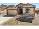 Lovely house with a two car garage, stone accents, gravel landscaping, and easy front entry at 17855 Lake Side Dr, Monument, CO 80132