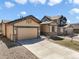 Charming home with a well-maintained lawn, an attached two-car garage, and a concrete driveway at 17855 Lake Side Dr, Monument, CO 80132